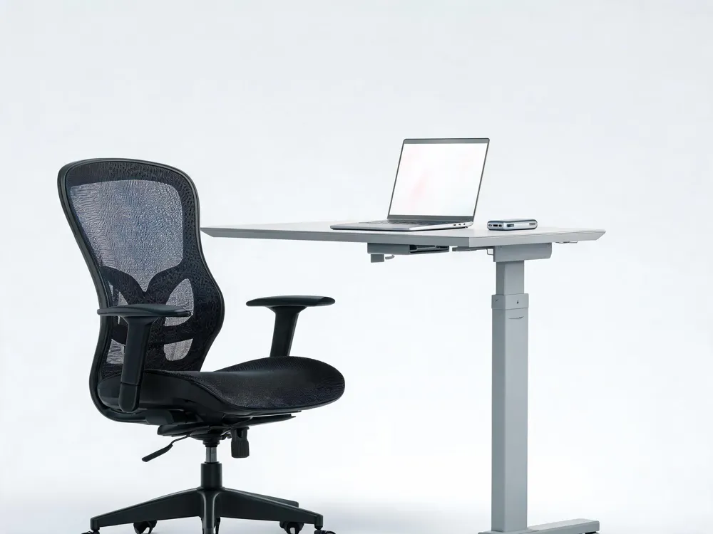 A sleek high‑performance laptop with a 10 000 mAh power bank and an ergonomic chair beside a standing desk, illustrating the essential hardware for remote work.