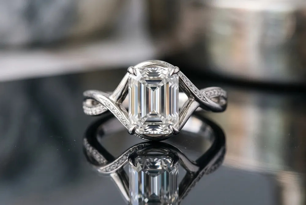 The emerald cut's refined step facets create a hall of mirrors effect, offering understated luxury and a quiet, architectural brilliance.
