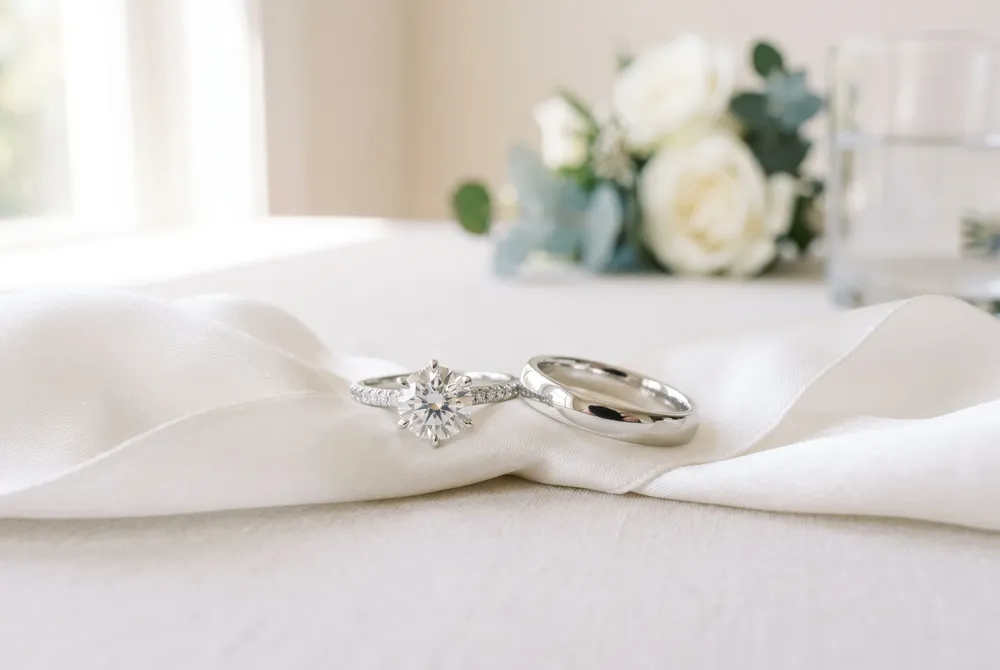 The engagement ring is your statement piece for special moments, while the wedding band is designed as your steadfast companion for every day, balancing beauty with resilience.