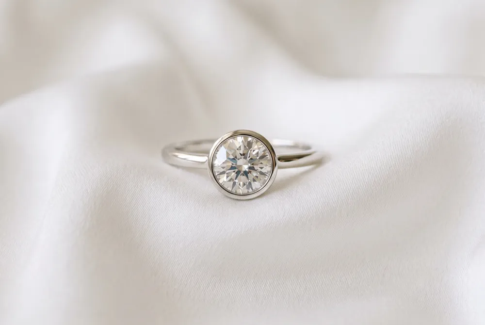 Experience the perfect marriage of modern artistry and everyday security with a sleek, bespoke bezel setting tailored to your lifestyle.