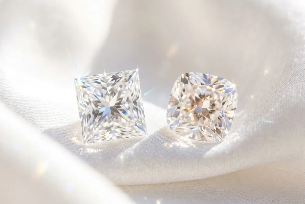 Discover how the princess cut’s sharp facets and the cushion cut’s rounded facets create two distinct signatures of light and fire.