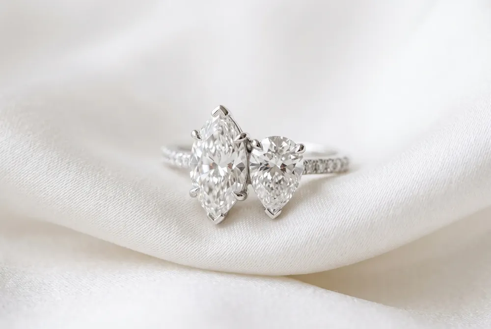 The union of marquise and pear diamonds in a Toi et Moi setting celebrates the sophisticated harmony of contrasting silhouettes.