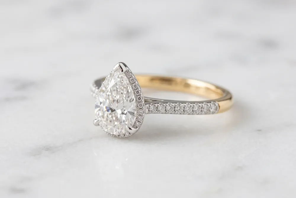 A new generation embraces the pear cut with larger carat sizes and personalized two-tone designs, celebrating individuality alongside tradition.