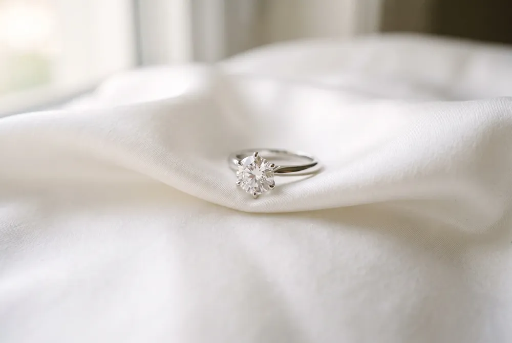 A contour eternity band’s subtle curve mirrors the shape of an engagement ring’s center stone, ensuring a seamless, custom-fit look that feels intentionally designed for your set.