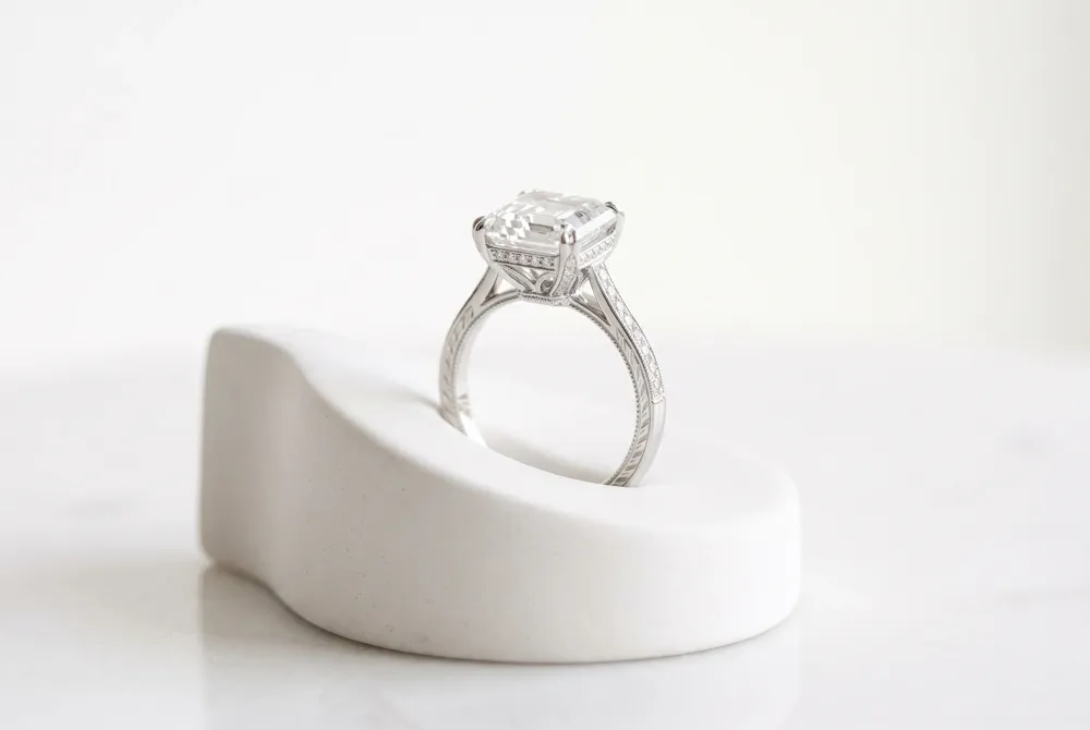 An Asscher cut brings crisp geometry and vintage character to a distinctly personal design.