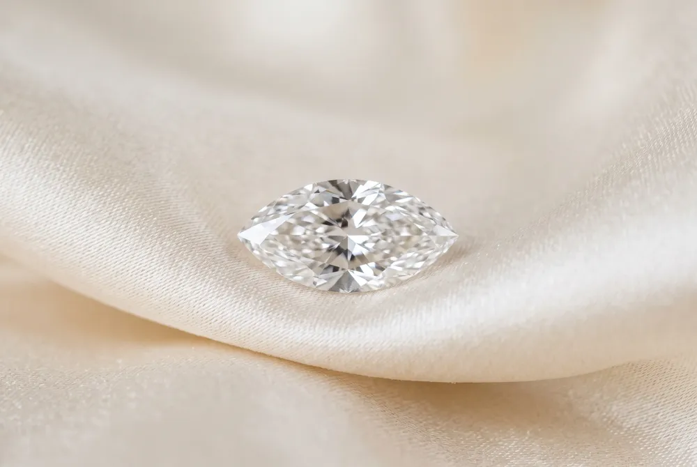 The marquise cut's elongated silhouette creates an unforgettable impression that bridges vintage charm and modern sophistication.