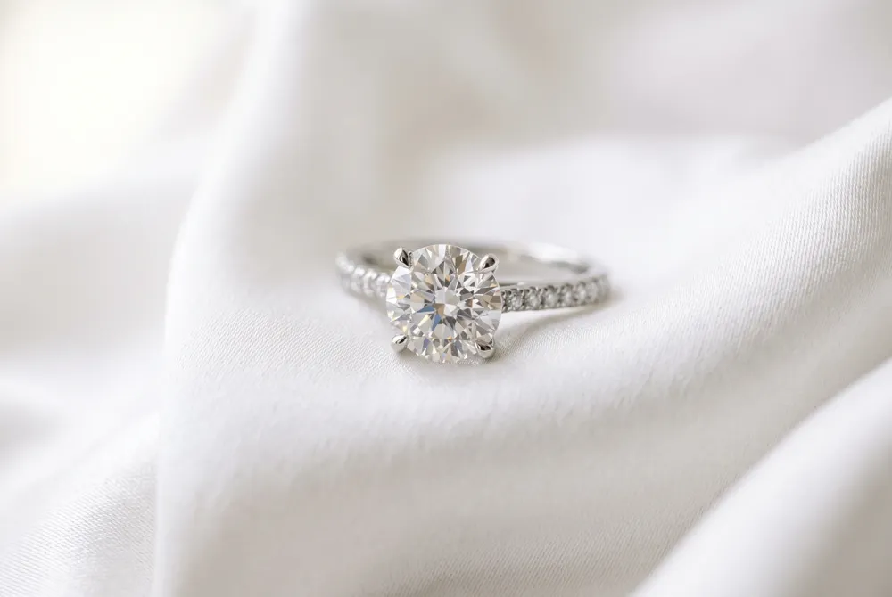 Tapered baguettes create a harmonious, regal silhouette that gracefully elongates the finger while emphasizing the step-cut profile of the center gem.
