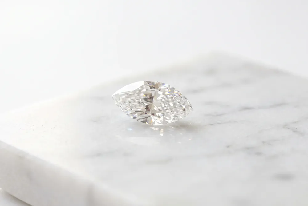 Discover how the graceful, elongated geometry of the marquise cut creates a sophisticated visual lengthening effect for the finger.