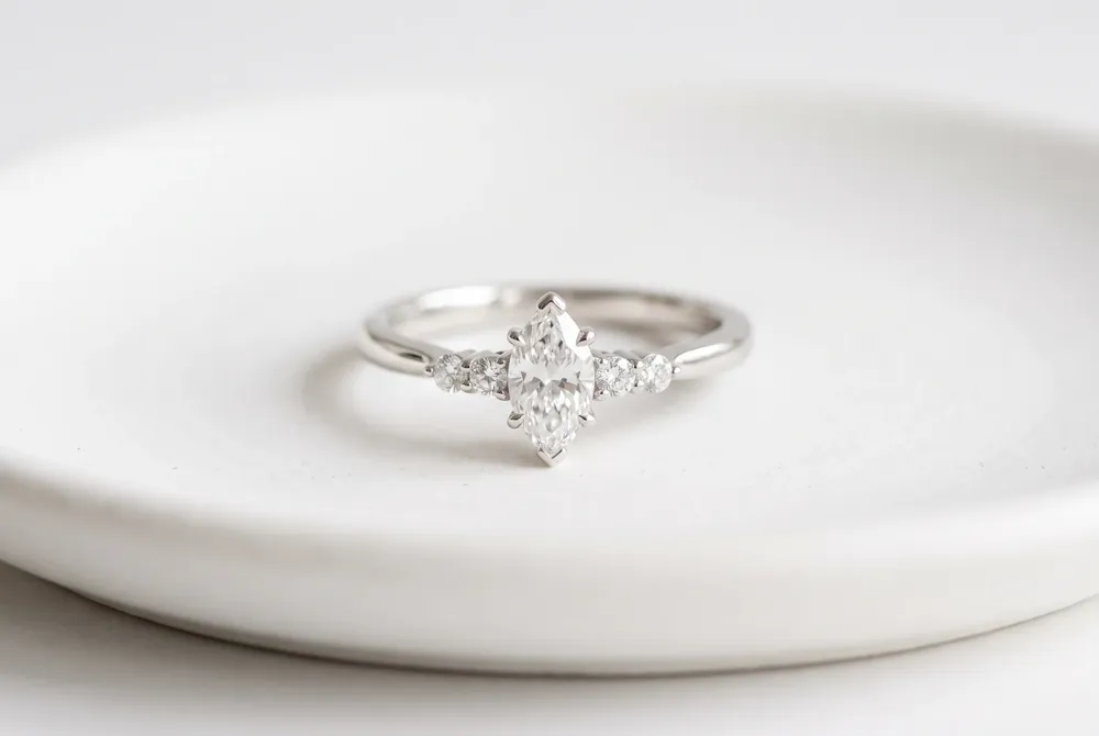 Flanked by two carefully chosen side stones, the center marquise tells a story of past, present, and future in a balanced, meaningful design.