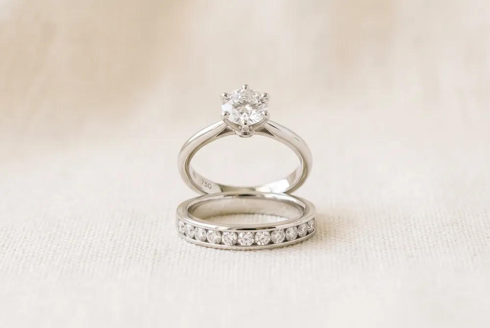 When worn together on the same finger, the engagement ring and wedding band create a harmonious stack, with the wedding band resting closest to the heart.