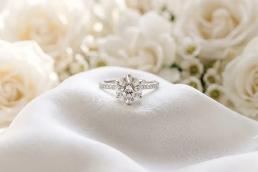 Adorn your hand with the organic elegance of floral-inspired settings, meticulously designed to complement the teardrop silhouette with artistic, botanical detail.