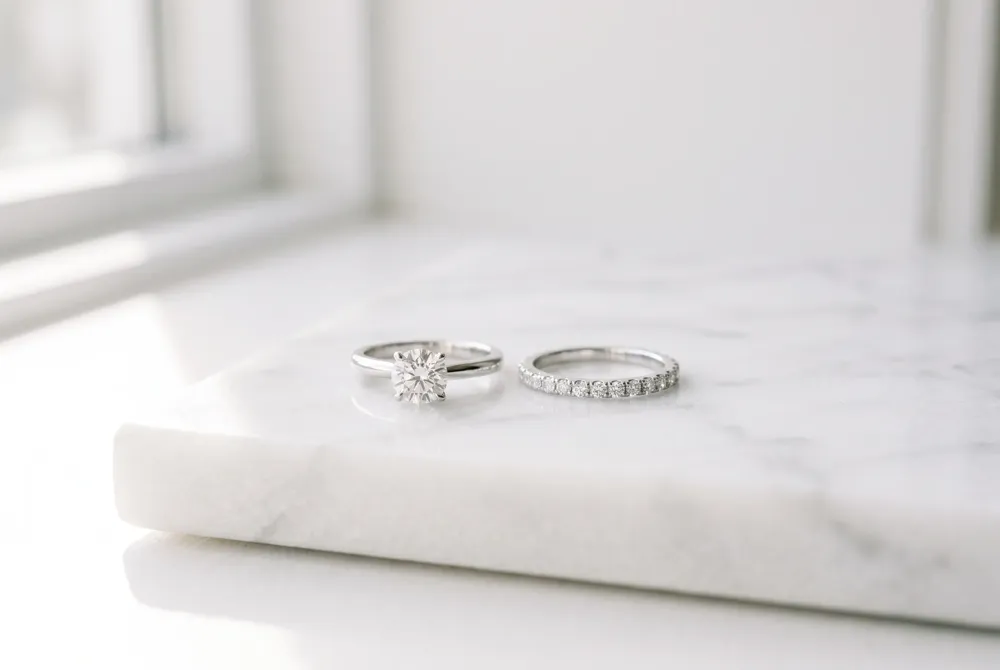 Understand the distinct symbolism behind your engagement ring and wedding band as they mark the beautiful chapters of your lifelong journey together.