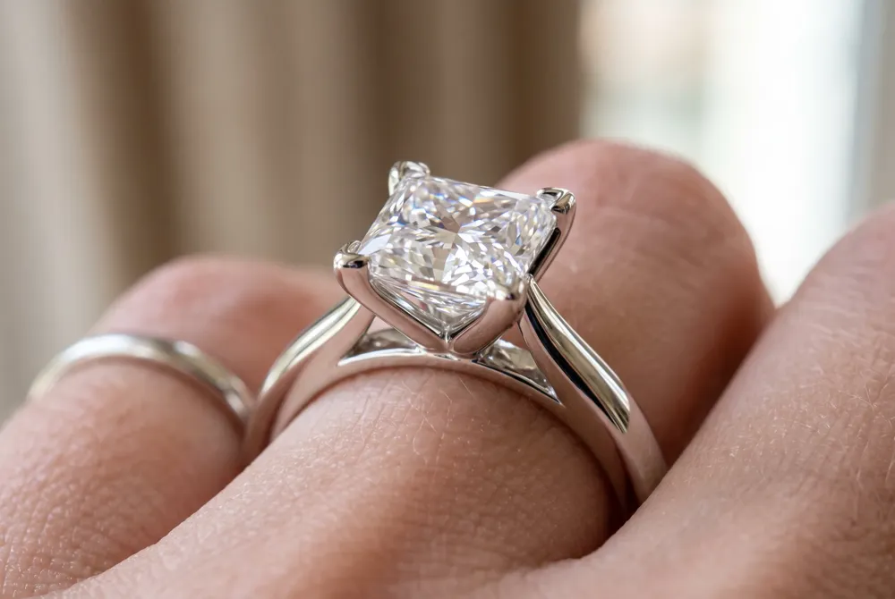 Protected by V-shaped prongs, a bezel, or French corner settings, a princess cut diamond becomes a resilient choice for everyday elegance.