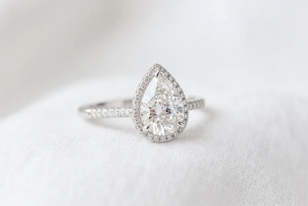 A pear-shaped diamond faces up 15 to 20 percent larger than a round brilliant of the same carat weight, making it a graceful and practical choice for those seeking presence without proportional cost.