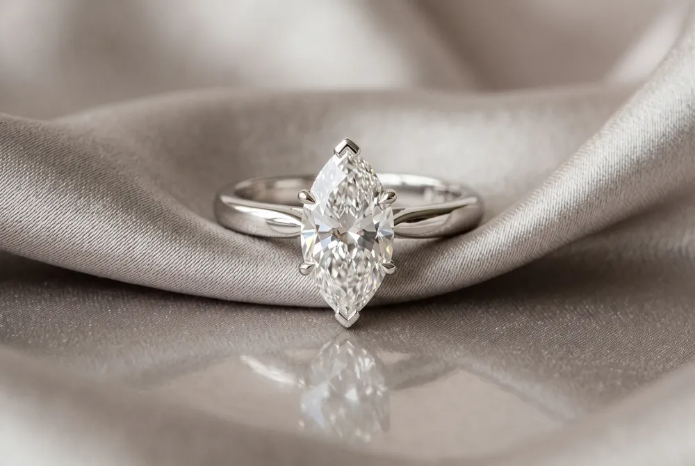 Discover how the marquise cut's elegant, elongated silhouette creates the illusion of a larger stone while lending a refined, finger-flattering sophistication.