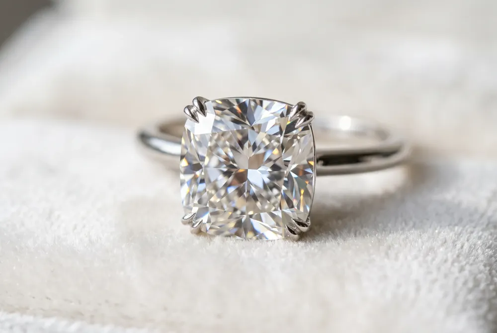 Examine the artisanal details and antique-inspired facets that comprise the iconic allure of a vintage-style cushion cut.