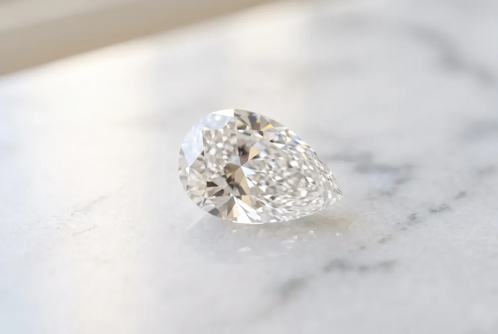 Embrace the graceful, teardrop silhouette of the pear cut, a timeless selection designed to elongate the finger with unmatched elegance.