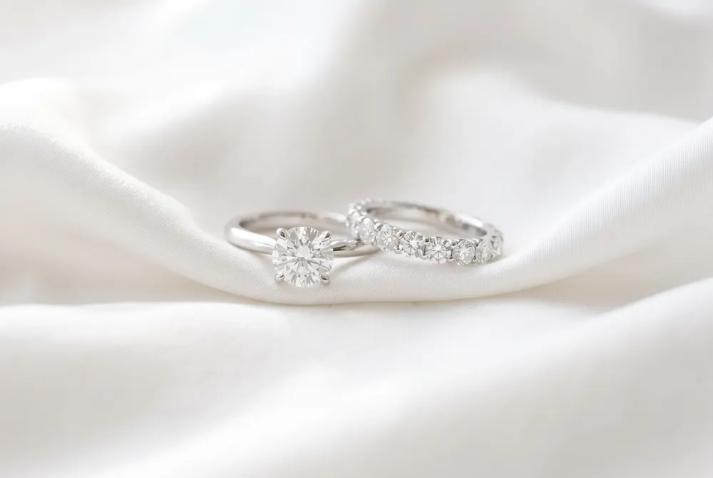 Distinguish between your luminous engagement piece and the enduring wedding band as you mark the chapters of your shared journey.