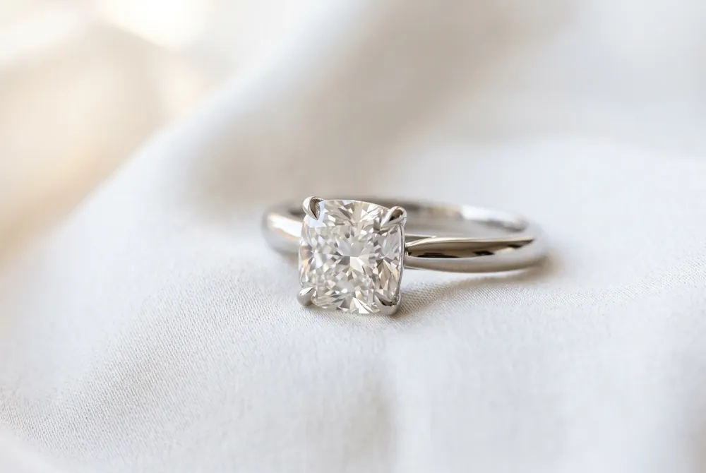 A horizontal east-west orientation provides a bold and fashion-forward twist to the traditional soft beauty of the cushion cut.