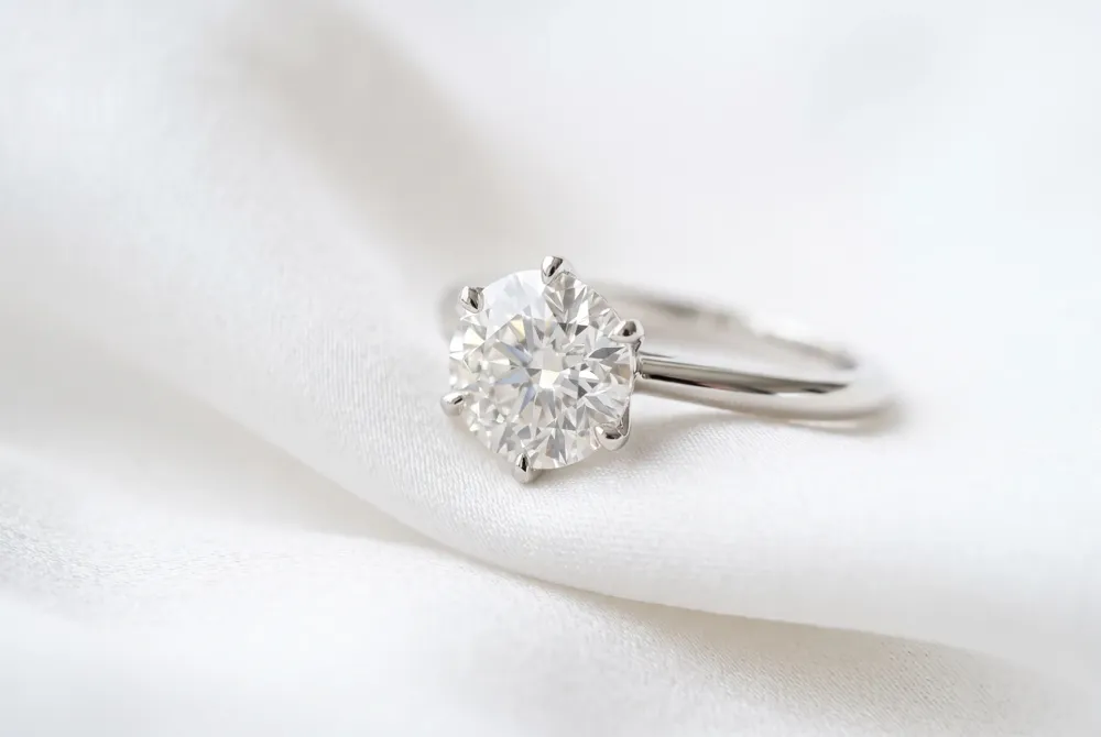 Discover how the structural grace of a cushion cut or the bold geometry of a princess cut can beautifully symbolize the unique narrative of your love story.