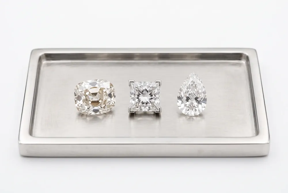 The true identity of Taylor Swift's ring is an elongated old mine cut, distinct from both princess and pear shapes.