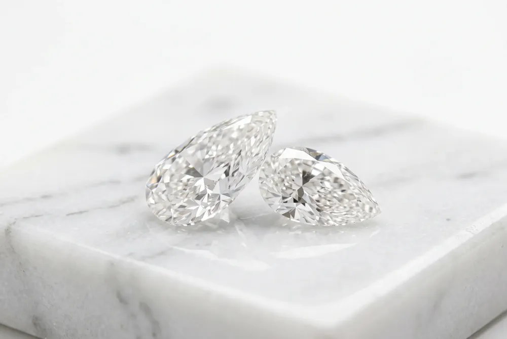 Celebrate your singular union with our bespoke Toi et Moi designs that harmoniously pair the pear cut with your choice of exquisite companion stones.