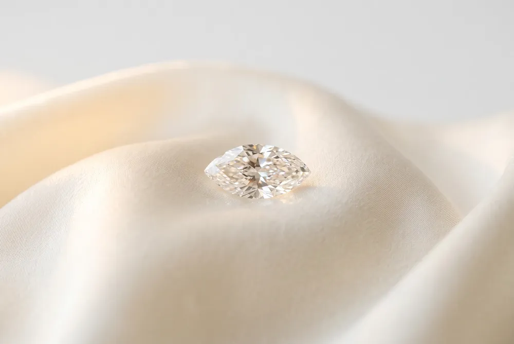 Discover the storied beginnings of the marquise cut, a silhouette born from royal romance and crafted to capture a legendary smile.