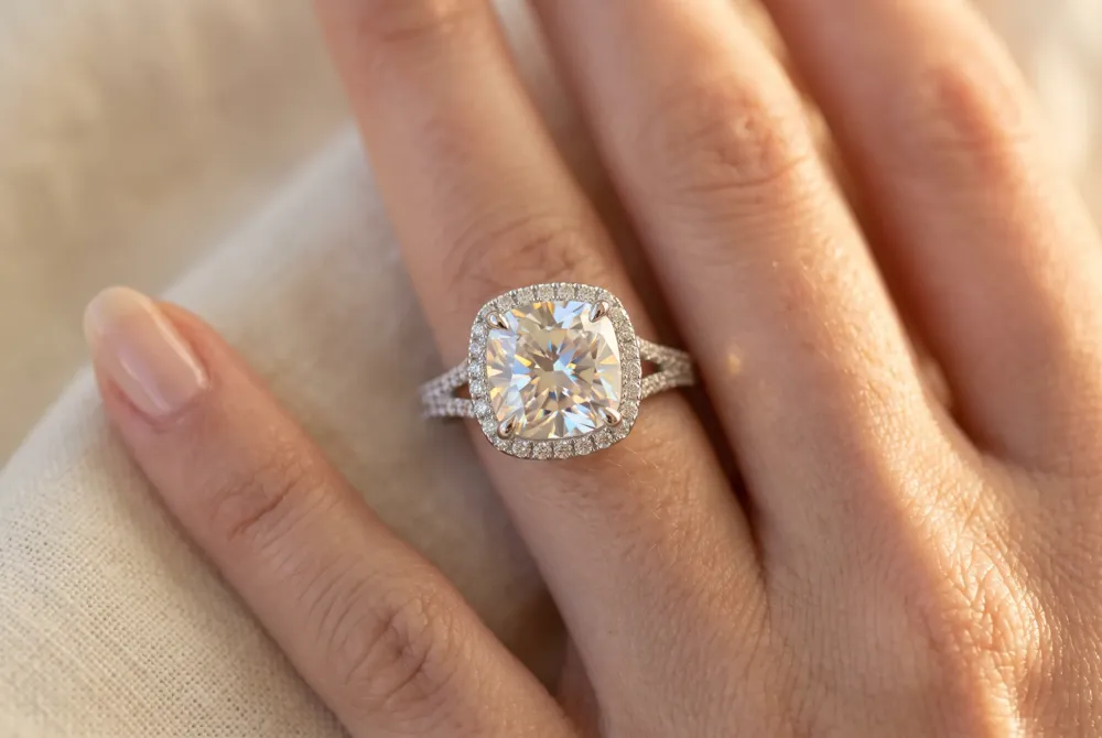 Cushion cut moissanite captures the luminous glow of antique gems while delivering superior brilliance, making it an ideal choice for couples seeking timeless romance.