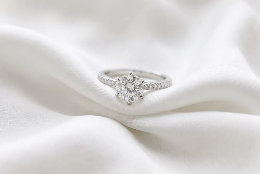 Refine your bridal set with custom-contoured bands and intricate artisanal details designed to perfectly complement your unique diamond silhouette.