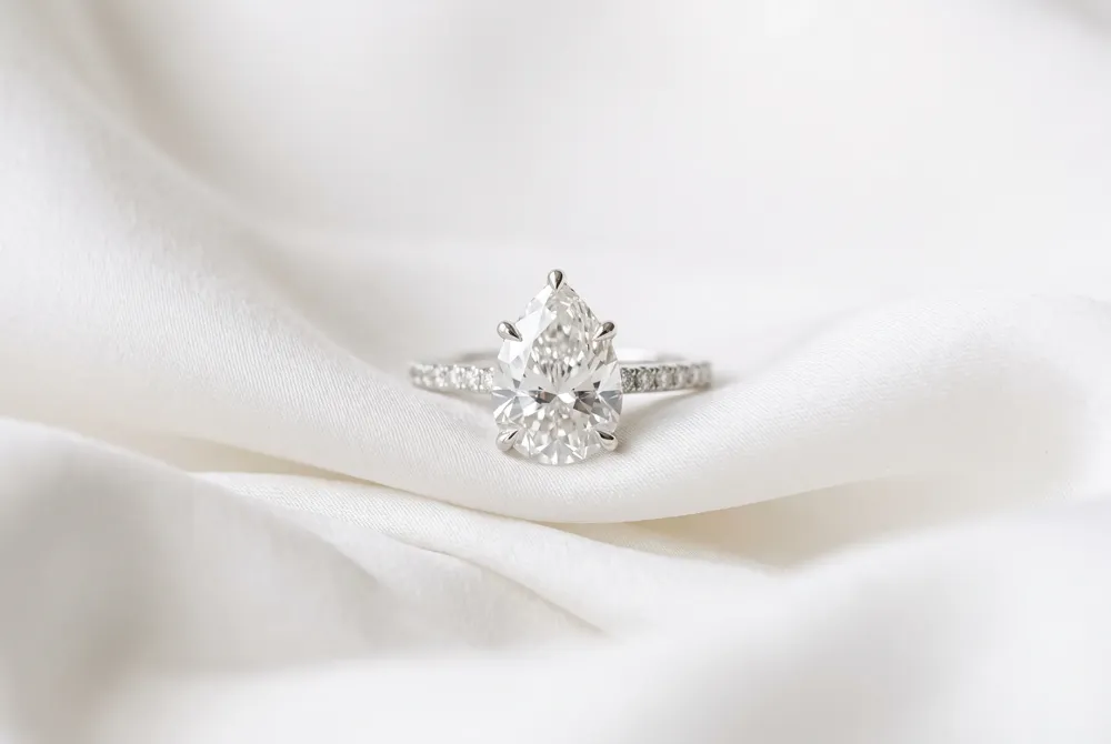 By choosing a pear-shaped diamond, you gain a significantly larger visual presence on the finger without compromising on the brilliant quality of an investment-grade heirloom.