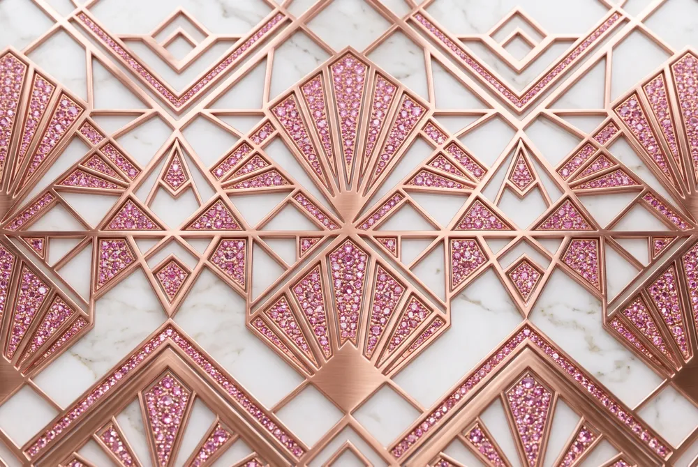 Bold geometric lines and baguette accents frame a pink moissanite in rose gold, capturing the architectural elegance and glamour of the Art Deco era.